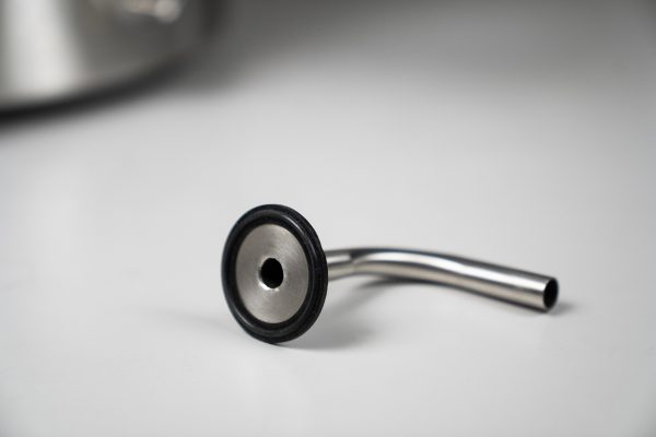 Stationary dip tube with an integrated overmolded gasket.